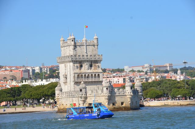 The tower with a tour boat passing