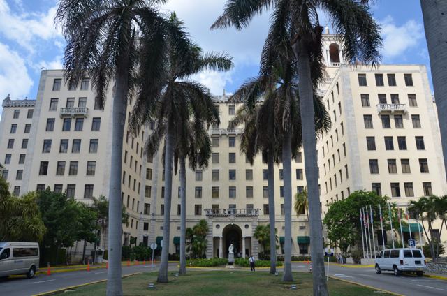A grand hotel framed by palms
