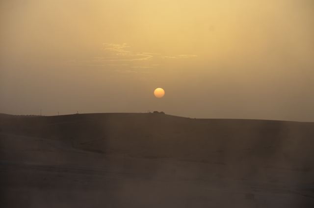 Sunset over the desert hills