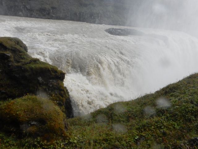 A powerful waterfall thundering into a canyon