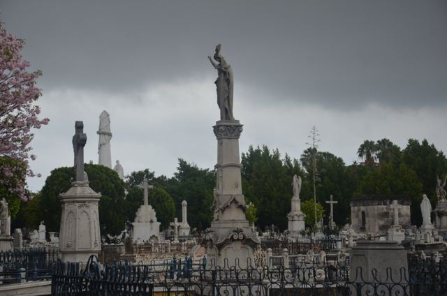 Cemetery monuments under a stormy sky