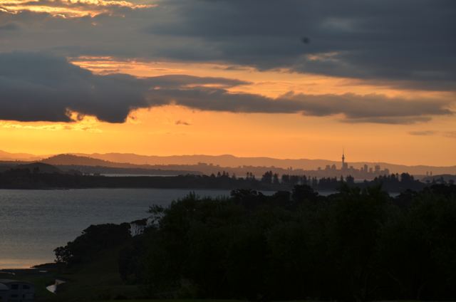An orange sunset over a bay