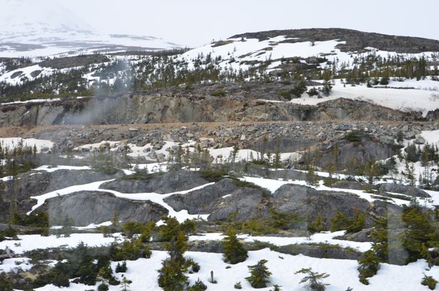 Snow-covered ground under cloud