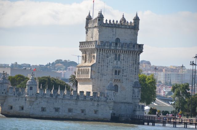 A stone tower at the water's edge