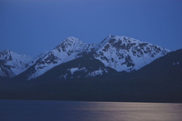 Mountains at dusk above a dark sea