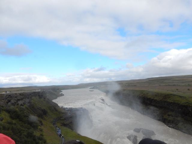 A river flowing out of a waterfall canyon