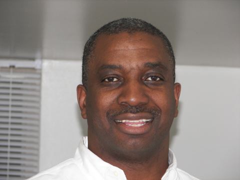 Smiling man in a white shirt